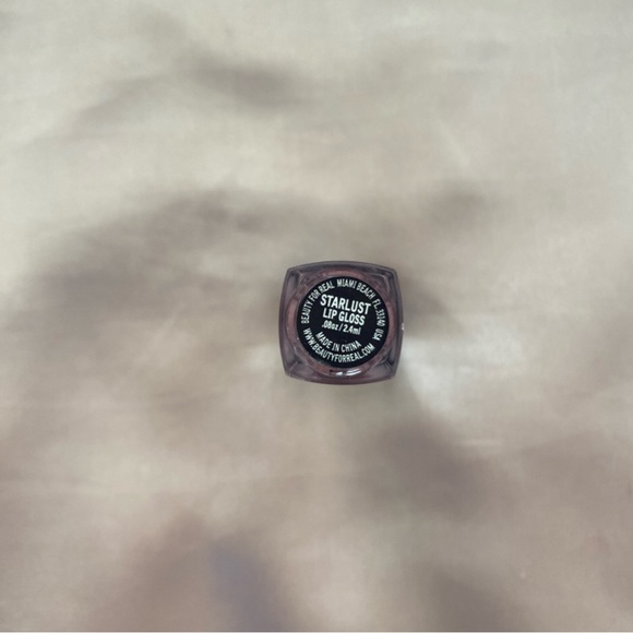 6/$40 or 9/$50 Beauty For Real Lipgloss in shade “Starlust” - Picture 2 of 2